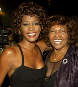 Freddie Garland former wife and daughter Whitney Houston during an event.